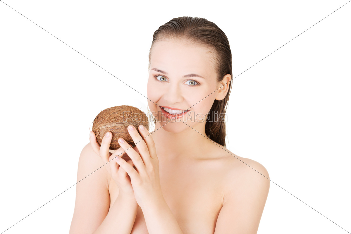 Atractiva mujer joven desnuda sosteniendo un coco. - Foto de archivo  #10241833 | Agencia de stock PantherMedia