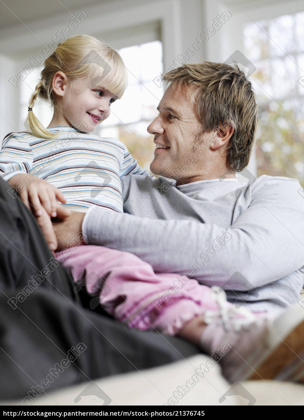 Girl Sitting On Father s Lap In House - Stock Photo #21376745 |  PantherMedia Stock Agency